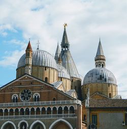 View of temple building against cloudy sky