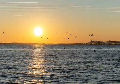 Scenic view of sea against sky during sunset
