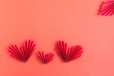 Monochrome red background with origami hearts. family concept. st. valentine's day.