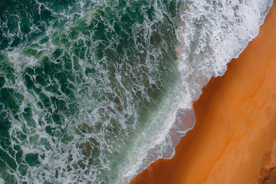 Close-up of surf on beach