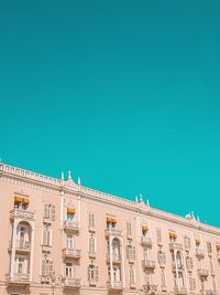 Low angle view of building against blue sky