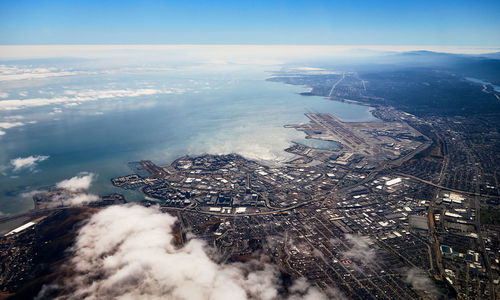 High angle view of sea and buildings against sky