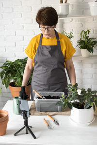 Boy watering plants