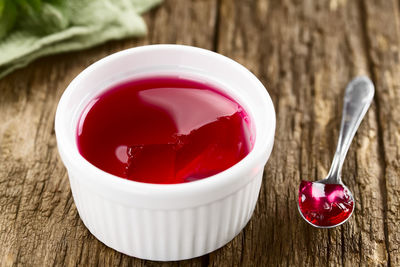 High angle view of red fruit in plate on table