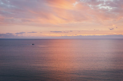 Scenic view of sea at sunset