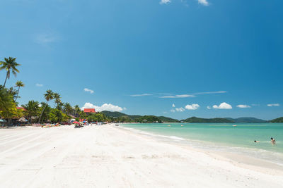 View of beach against blue sky