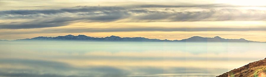 Scenic view of mountains against sky during sunset