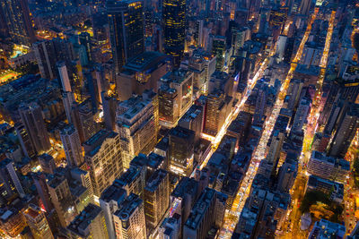 High angle view of city lit up at night