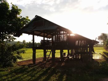 Built structure on field against sky