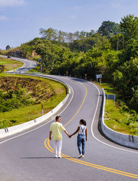 High angle view of people walking on road