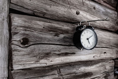 Close-up of clock on wood