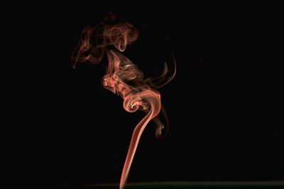 Close-up of fire against black background