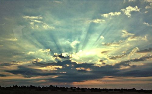 Scenic view of cloudy sky at sunset