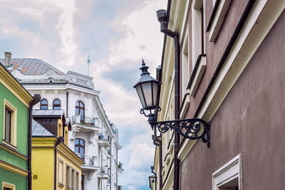 A beautifully decorated city lantern in the form of a wall lamp.  zamosc, poland