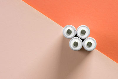 High angle view of eyeglasses on table against wall