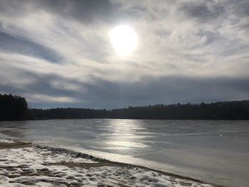 Scenic view of frozen sea against sky during winter