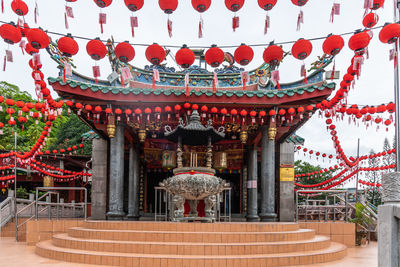 Lantern hanging outside temple against building