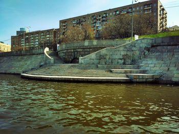 River by built structure against sky