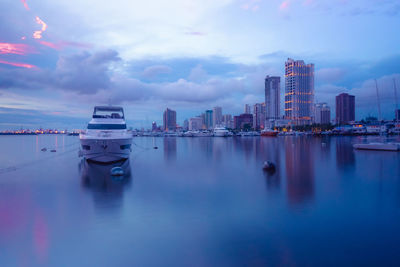 Panoramic view of sea and buildings against sky