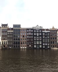 View of buildings in city against sky