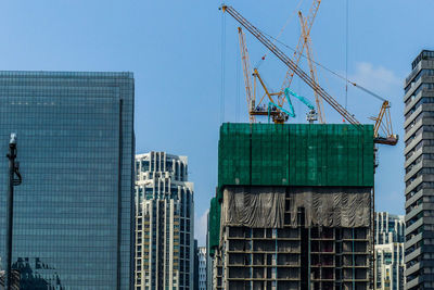 Low angle view of modern buildings against clear sky