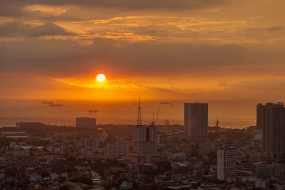 Cityscape against sky during sunset