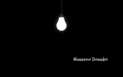 Low angle view of illuminated lighting equipment against black background