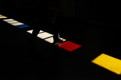 Low section of person standing on chair