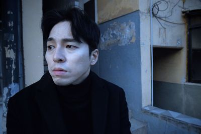 Portrait of young man looking away