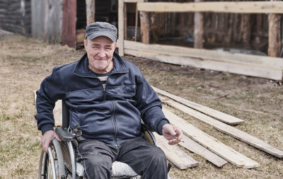 Portrait of man sitting outdoors