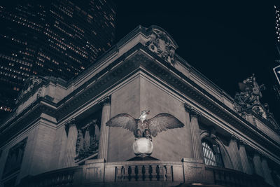 Low angle view of statue at night