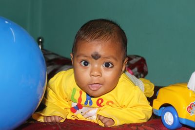 Portrait of cute boy with toy