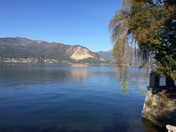 Scenic view of lake against clear blue sky