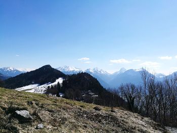 Scenic view of mountains against sky during winter