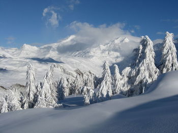 Scenic view of snowcapped mountains against sky