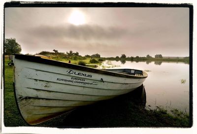 Boats moored in lake