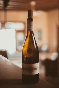 Close-up of beer bottle on table