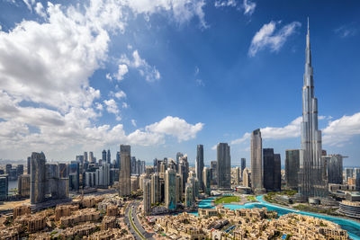 Modern buildings in city against sky