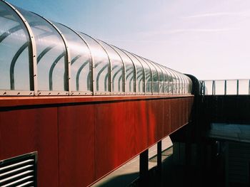 Long covered footbridge against the sky