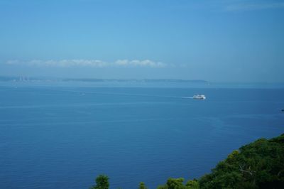 Scenic view of sea against blue sky