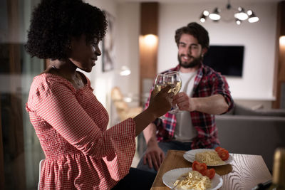 African american woman having romantic dinner with boyfriend