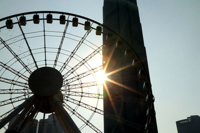 Low angle view of ferris wheel against sky