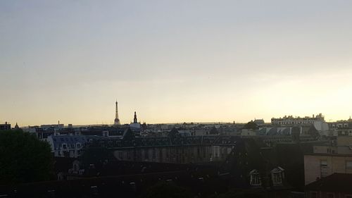Cityscape against sky during sunset