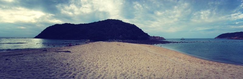 Scenic view of sea against cloudy sky