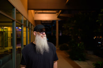 Man wearing sunglasses standing outdoors