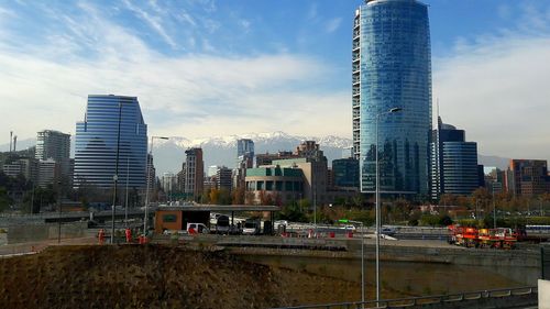 Modern buildings in city against sky