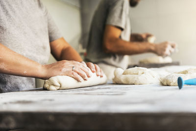 Midsection of man preparing food