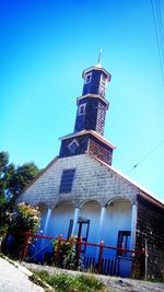 Low angle view of tower against clear blue sky