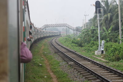 Train on railroad tracks against sky