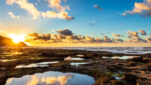 Scenic view of sea against sky during sunset